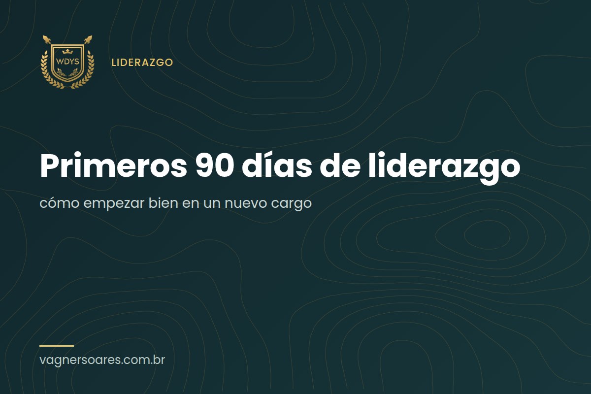 Un hombre de camisa blanca escucha con atención a una colega de espaldas, en una mesa bajo la luz de las persianas